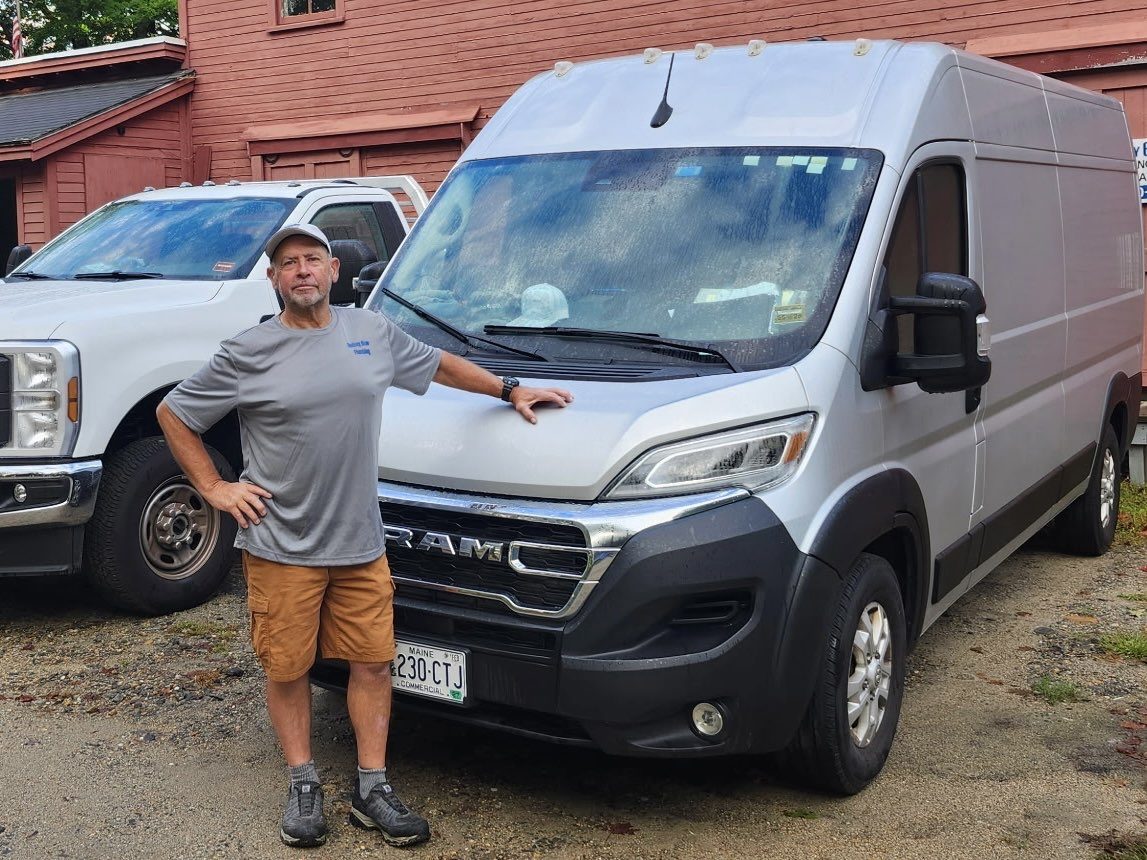 Rod Blow beside his Rodney Blow Plumbing service van