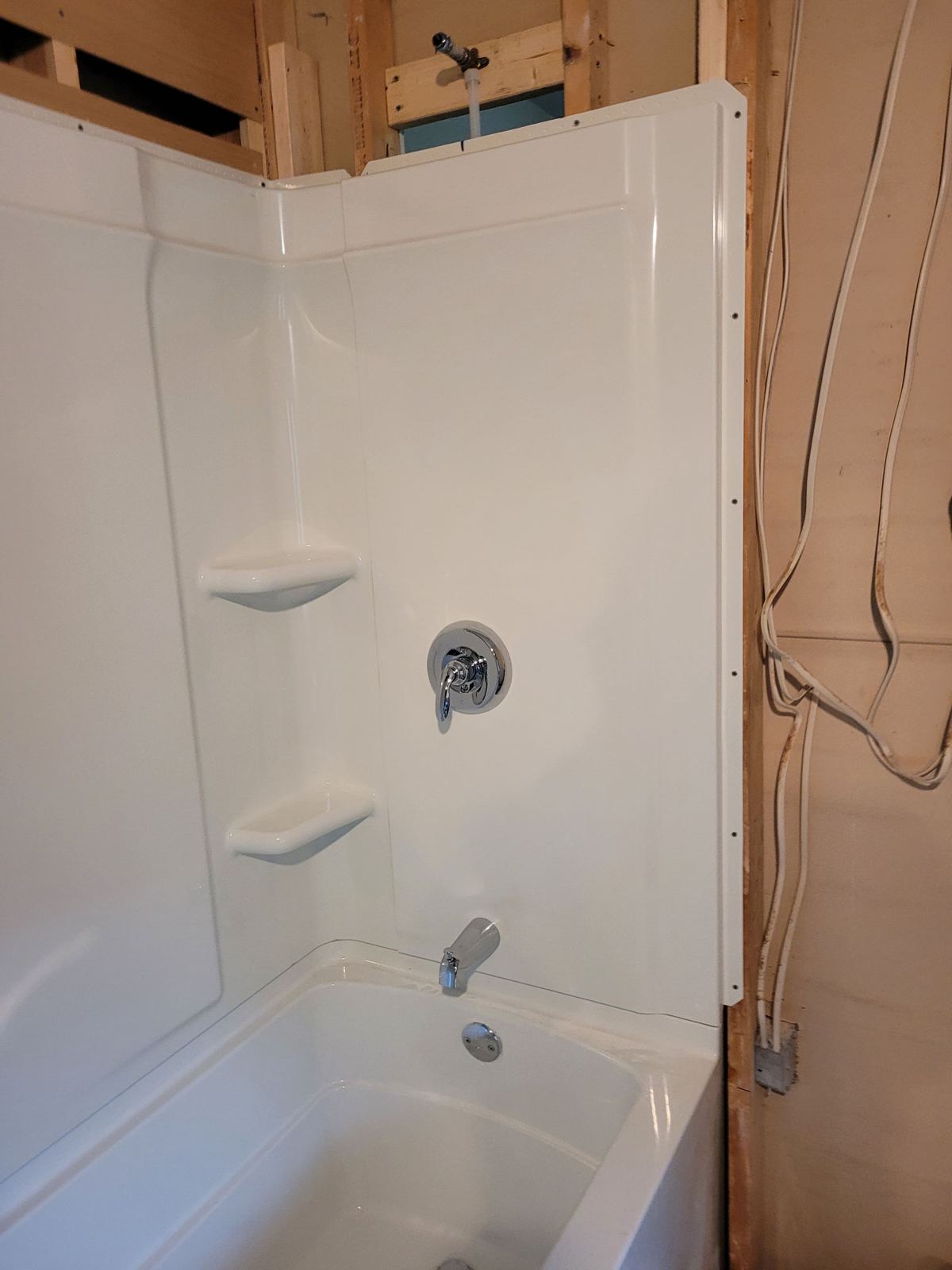 New tub and shower surround installed during a bath remodel