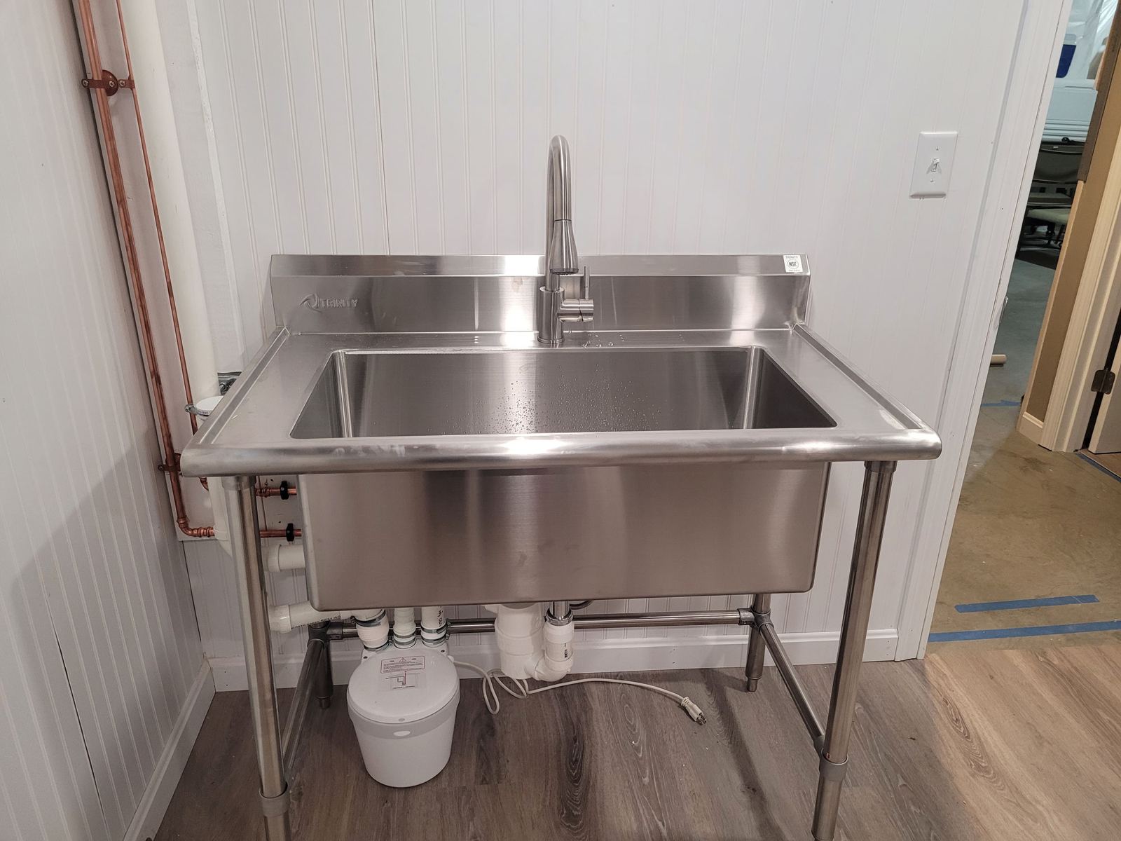 Stainless steel utility sink with pull-down faucet and new supply and drain lines